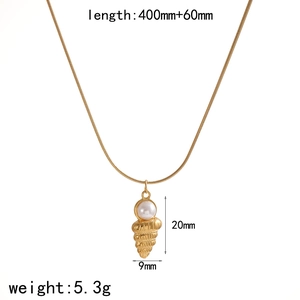 Detail view of 18k gold conch shell pendant with pearl and specific size measurements