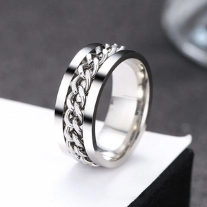 Macro shot of rotatable chain ring for men featuring polished stainless steel details