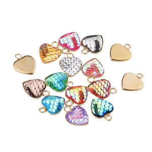Golden heart pendants with vibrant fishscale patterns in multiple colors for DIY jewelry