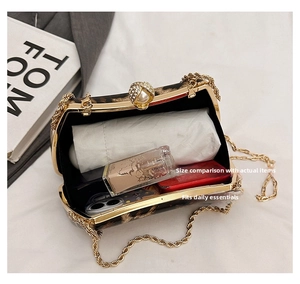 Internal view of leopard print box clutch bag showing capacity for phone and makeup