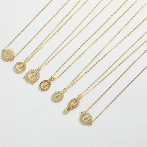 Detailed row of gold religious pendants with zircon stones and saint relief engravings