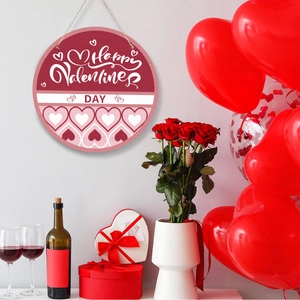 Round wooden Happy Valentine's Day sign hanging with roses and red balloons decor