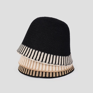 Detail of striped knitted bucket hats showing textured fabric and color variations