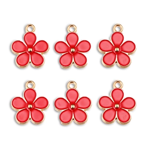 Detailed view of six red flower alloy charms with gold edges for DIY jewelry making