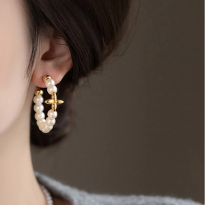 Elegant gold plated hoop earrings with micro-set pearls and a central floral accent