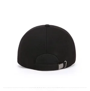 Rear view of black wool baseball cap featuring adjustable metal buckle and six-panel crown