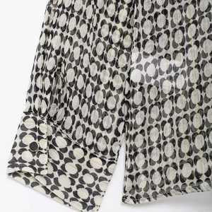 Elegant French style chiffon shirt with geometric print and gold button detail on the cuff