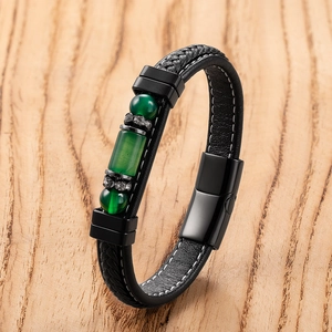 Detail of woven leather bracelet featuring green natural stones and magnetic clasp