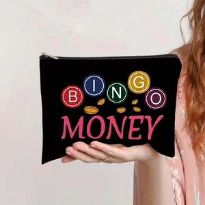 Close-up of black canvas bag with BINGO MONEY print and a silver metal zipper detail