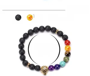 Lava stone chakra bracelet detail with 8mm beads and golden leopard head charm