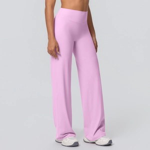 Detail of pink high-waisted yoga flare pants with smooth brushed fabric texture