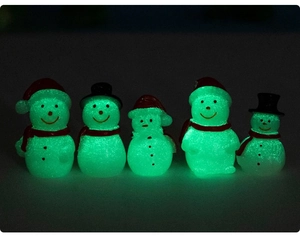 Five mini glow-in-the-dark snowman figurines with colorful hats for DIY decor