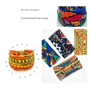 Detailed pattern overview of wide elastic headbands with colorful African floral prints