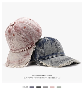 Close-up of vintage washed baseball caps with distressed brim details in multiple colors