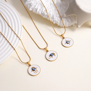 Golden evil eye necklaces with Fatima hand, elephant, and octagram star enamel pendants