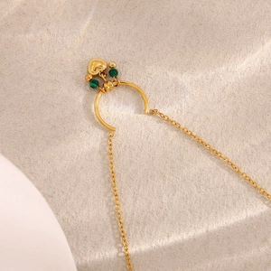 Detailed close-up of 18K gold plated stainless steel U-pendant with heart and green beads