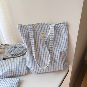 Detailed set of blue gingham cotton tote bag with matching pouch and hair scrunchie
