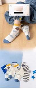 Detail of five pairs of space-themed mesh cotton socks with UFO and astronaut patterns