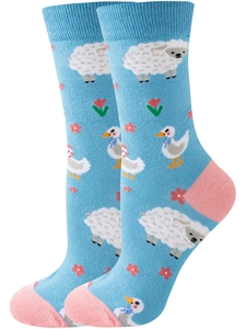Detail of light blue crew socks with white sheep, duck motifs and pink contrast heel