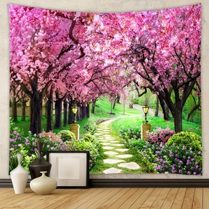 Detail of a cherry blossom landscape tapestry hanging in a minimalist home setting