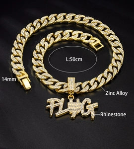 Detail shot of 14mm gold cuban chain with rhinestone PLUG pendant and 50cm length specs
