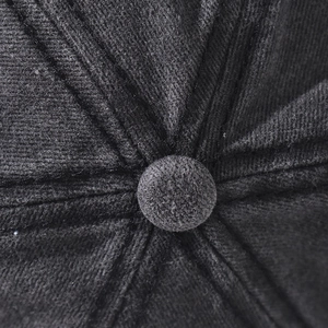 Detailed macro view of black washed twill fabric and top squatchee on the baseball cap