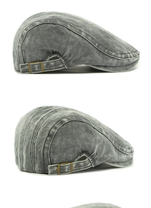 Detail view of washed herringbone cotton flat cap with brass adjustable side buckles