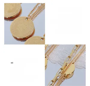Close-up of gold titanium steel coin pendant with OT buckle and mixed chain detail