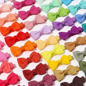 Set of colorful handmade grosgrain ribbon bow hair clips for baby girls in various candy colors