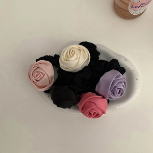 Set of five elegant satin rose hair ties in black, beige, pink, and purple colors