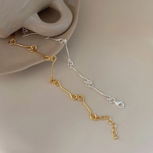 Elegant 925 sterling silver interlocking wave chain bracelet in gold and silver finish