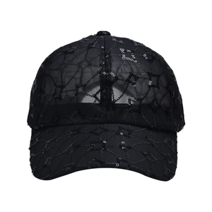 Detail of breathable black mesh baseball cap with shiny sequin star embroidery patterns