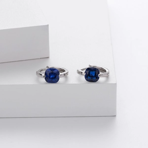 Detailed view of S925 sterling silver hoop earrings featuring square dark blue zircon stones