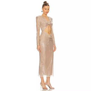 Sparkling champagne gold sequined evening gown with waist cutout and long sleeves