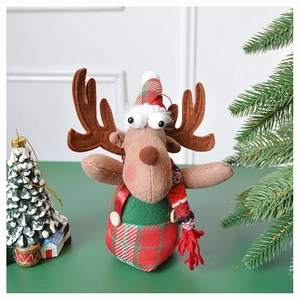 Close-up of Christmas reindeer plush doll with scarf and hat detail for holiday decoration