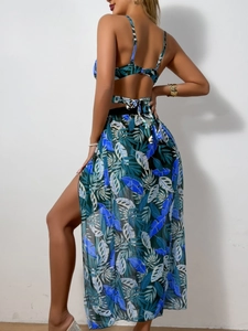 Detailed view of tropical leaf print bikini with matching side-slit mesh cover-up skirt