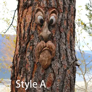 Detail of tree face garden decor featuring resin eyes and bearded mouth on a trunk