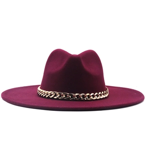 Classic burgundy fedora hat with gold metal chain trim in elegant minimalist style
