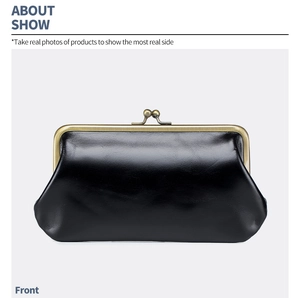 Macro shot of retro black leather clutch with vintage bronze kiss-lock closure and glossy finish
