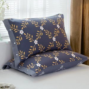 Pair of dark grey cotton pillowcases with white floral print and button closure