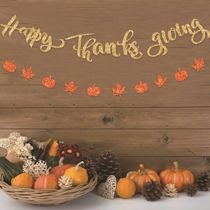 Glittering Happy Thanksgiving banner set with gold maple leaves and orange pumpkins decor