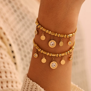 Golden stainless steel Roman numeral charm bracelet with zircon tassels for women