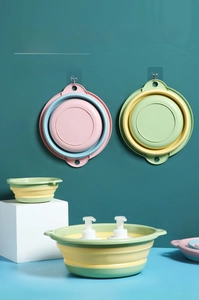 Close-up of thickened silicone folding basins showing hanging holes and space-saving design