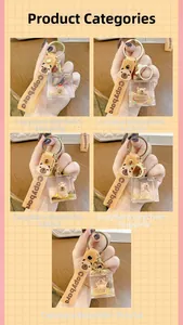 Macro view of five assorted Capybara floating oil keychains with gold glitter details