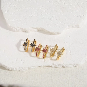 Three pairs of elegant snowflake zircon earrings in gold finish with blue, pink, and white stones