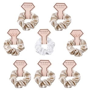8-piece set of champagne and white satin scrunchies with diamond-shaped wedding tags