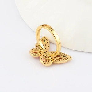 Detailed close-up of a golden butterfly ring with colorful rhinestones and adjustable band