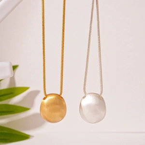 Minimalist oval bean pendant sweater necklace in gold and silver matte metal finish