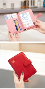 Detail view of pink travel passport wallet with multiple card slots and RFID protection