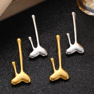 Abstract heart drop earrings in gold and silver stainless steel with a polished mirror finish